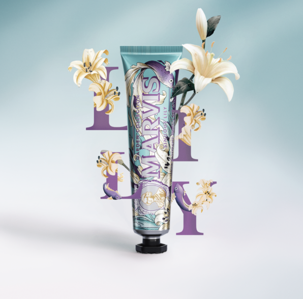 Marvis toothpaste tube with floral design on a light blue background